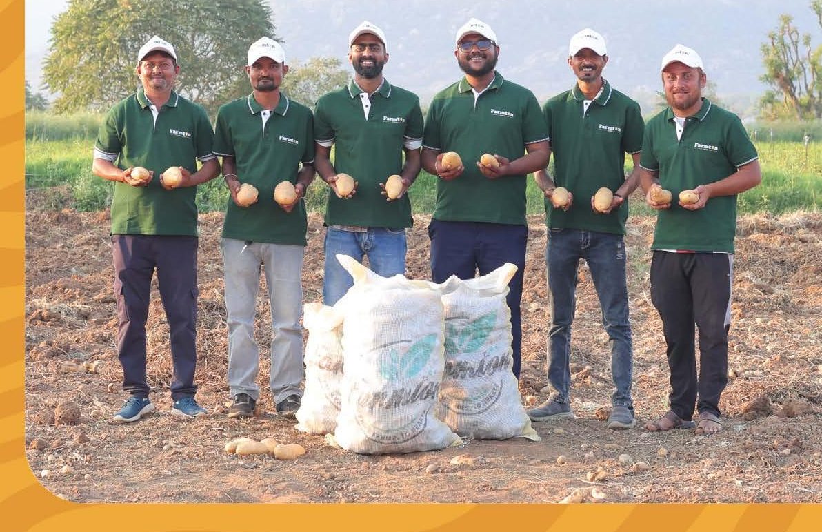 Farmton partner farmers holding freshly harvested potatoes